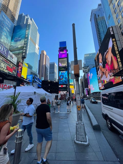 #1 Six Hour Bus Tour and Boat Ride By The Statue of Liberty - Lower Manhattan: Wall Street, Trinity Church, and the Battery Park build-up