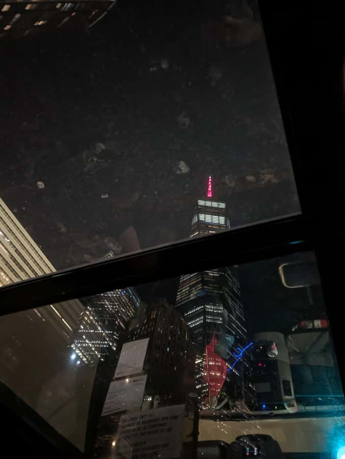New York City: Guided Private Glass-Top Bus Tour at Night - Back toward Times Square: riding through Midtown and crossing key bridges
