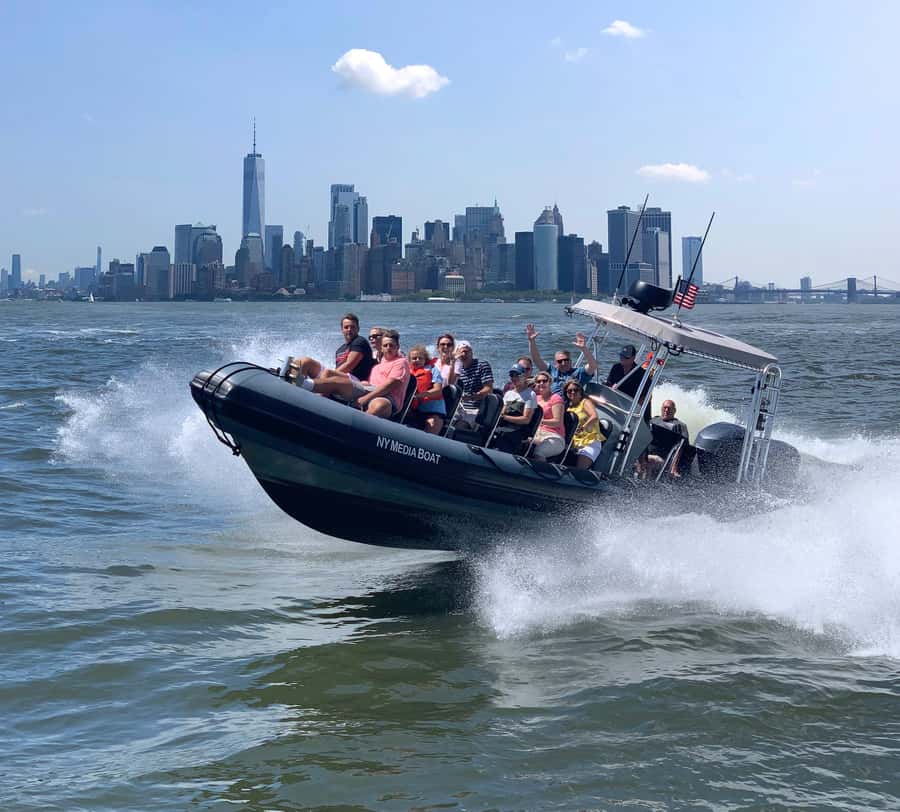 New York City: Harbor Speedboat Tour - Upper Bay crossing: tugboats, barges, and the Staten Island Ferry passing by