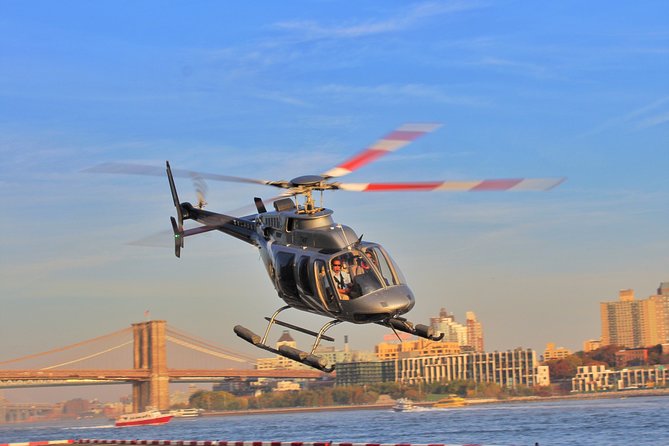 New York Manhattan Scenic Helicopter Tour - Ellis Island and the USS Intrepid pass: closing with meaning