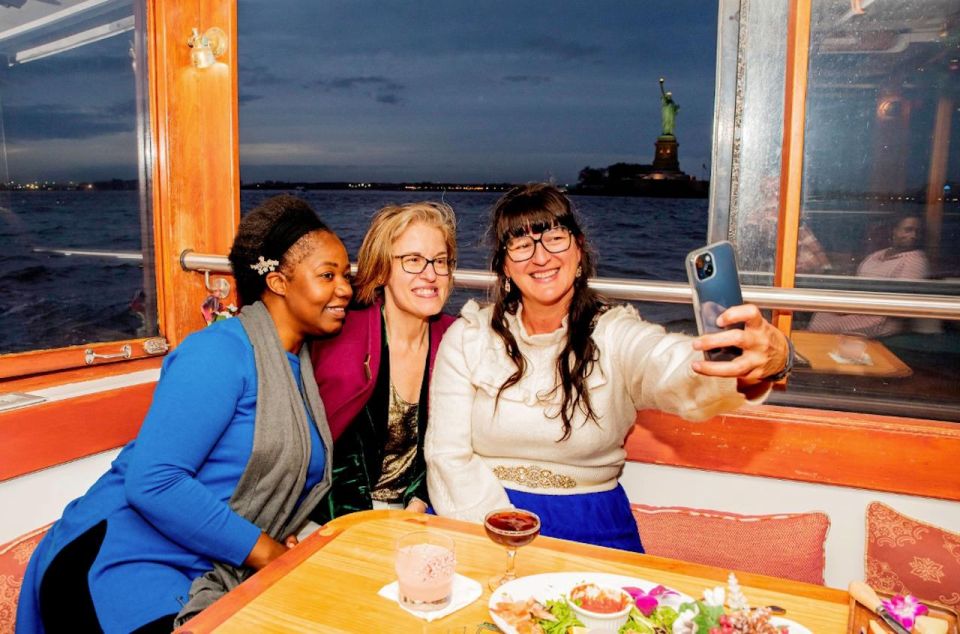 NYC: Night Holiday Lights and Cocoa Cruise - Inside the heated grand salon: comfort and a table-based experience