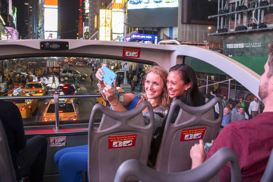 NYC: Sightseeing Night Tour by Open-Top Bus with Live Guide - Midtown at night: Times Square glow, Broadway theaters, and Lincoln Center vibes